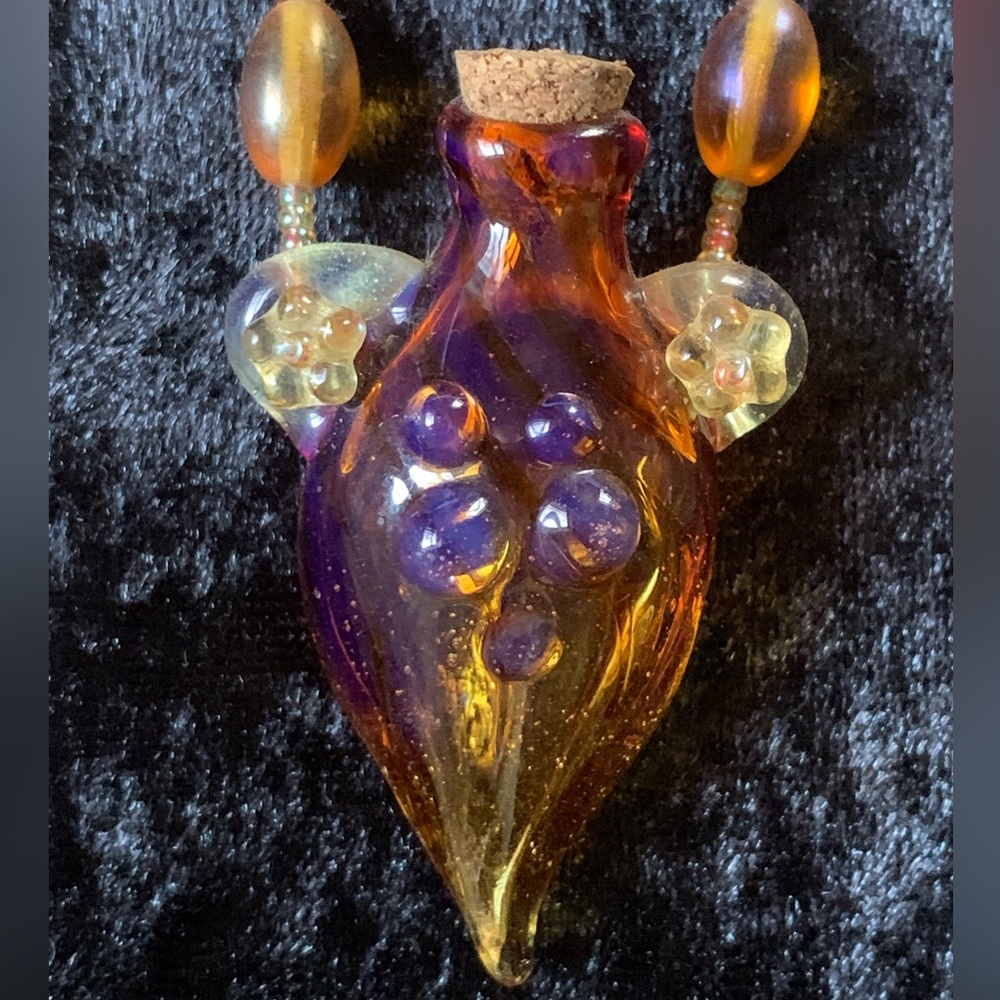 Blown amber colored glass bottle necklace